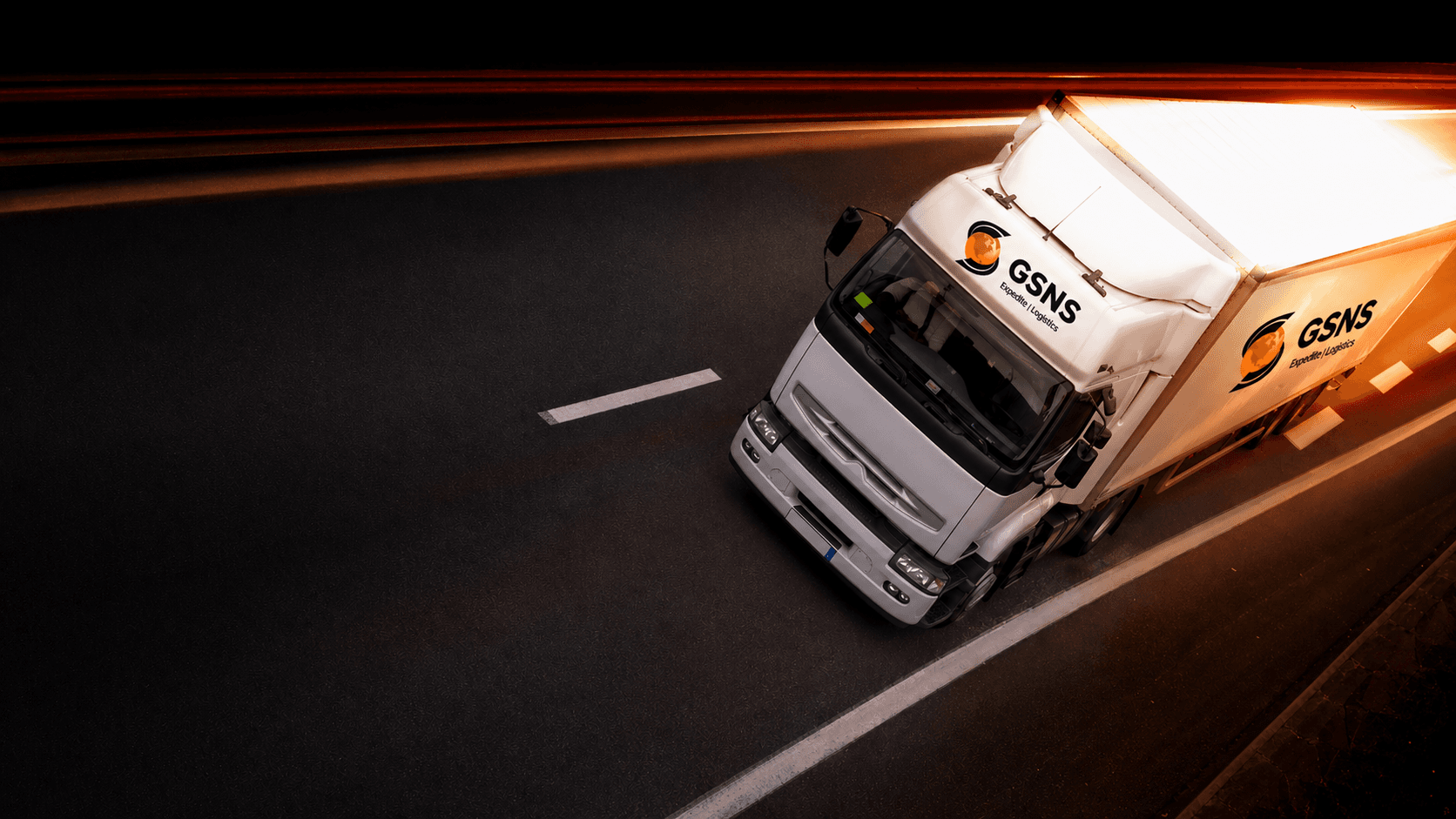 GSNS Expedite freight trailer in motion on a night highway